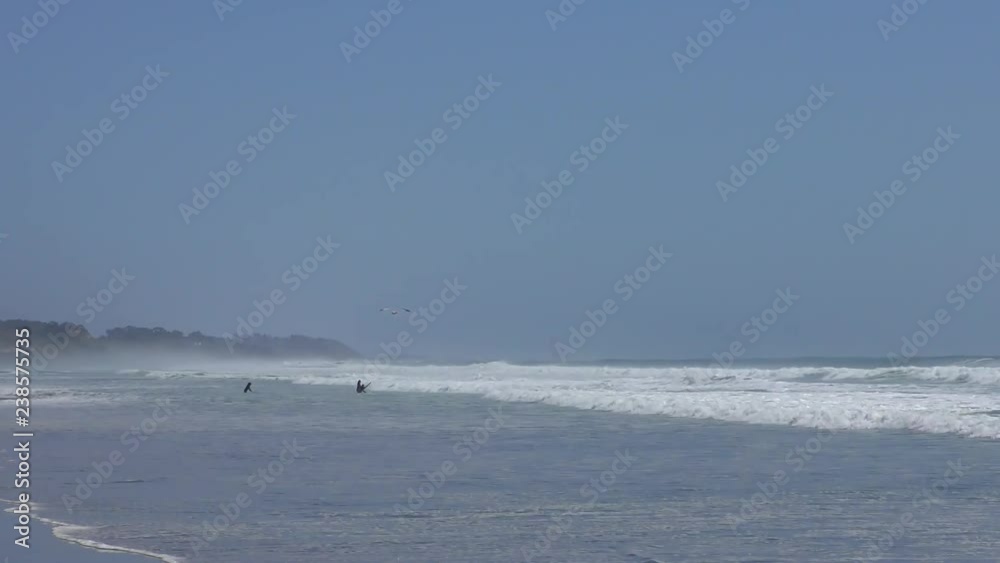 Unidentified surfers at Rio del Mar, Santa Cruz County, California, USA, on the 7th of June, 2018 Unidentified surfers at Rio del Mar, Santa Cruz County, California, USA, on the 7th of June, 2018