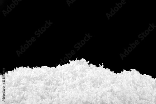 Snow on a black background, close-up.