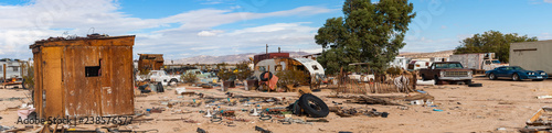 desert junkyard panorama in California photo
