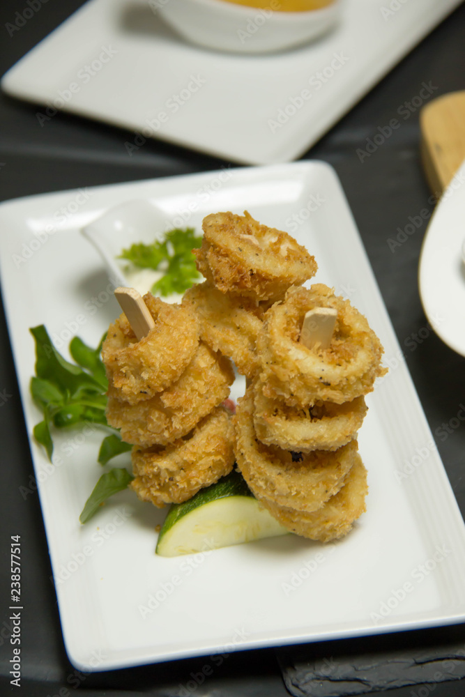 Tasty calamari rings deep fried in soft dough Tasty calamari rings deep fried in soft dough
