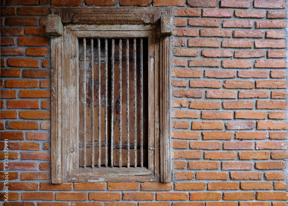 Old brick wall with brick window.