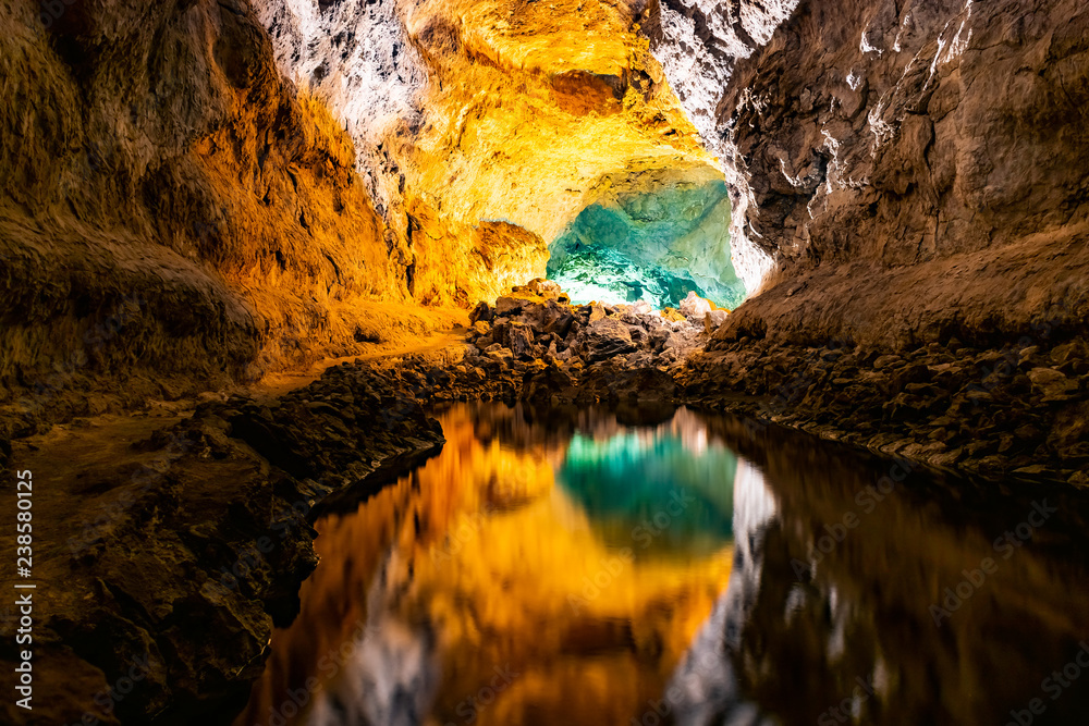 Water optical illusion reflection in Cueva de los Verdes, an amazing lava tube and tourist attraction on Lanzarote island, Spain. Water optical illusion reflection in Cueva de los Verdes, an amazing lava tube and tourist attraction on Lanzarote island, Spain.
