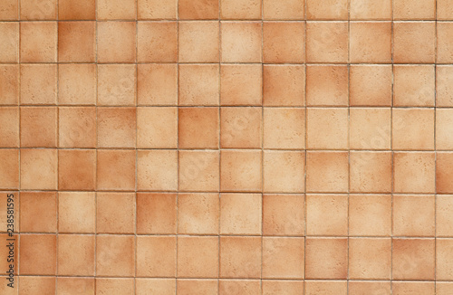 Brown tiled wall texture or background