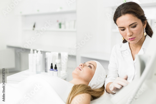 Beautician prepares equipment for the procedure face rejuvenation