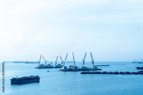 landscape of Cargo ships or Tanker trucks entering one of the busiest ports the Asia in morning. import,export logistic industrial Transportation concept © Joke Phatrapong