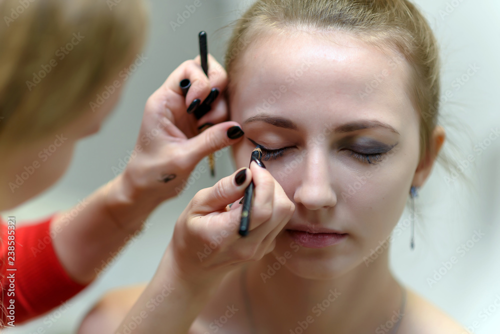 The concept of the work of the master makeup artist beautician. The concept of the work of the master makeup artist beautician.