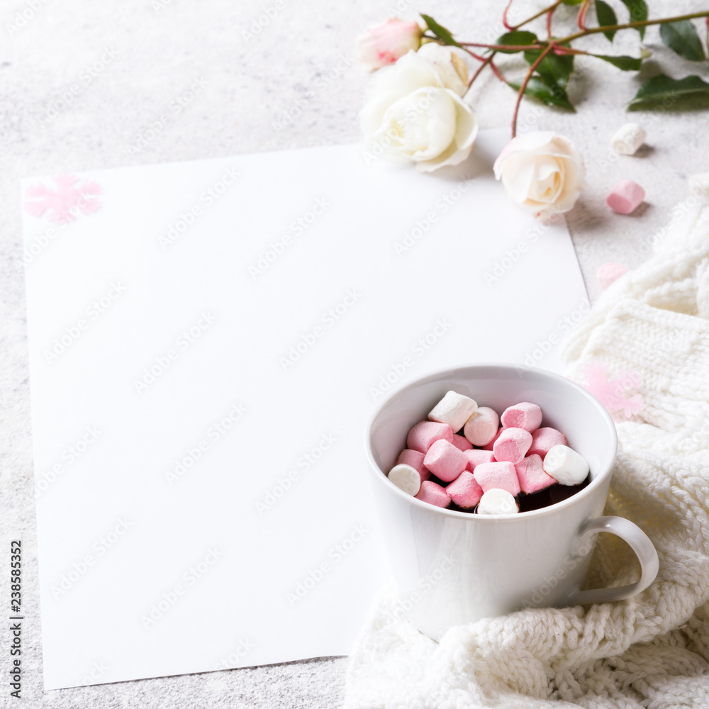 Creative winter natural composition with flowers, a cup of hot chocolate and marshmallows, with decoration pink color Flat lay Greeting card copy space.Christmas background Festive Drink concept.