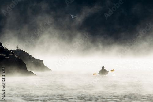 Paddling on an early December morning. © Gregory Johnston