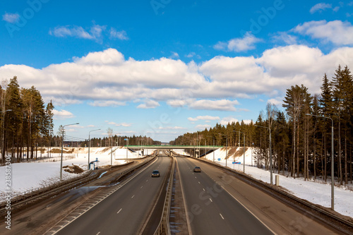 road in early spring, the snow has not melted.