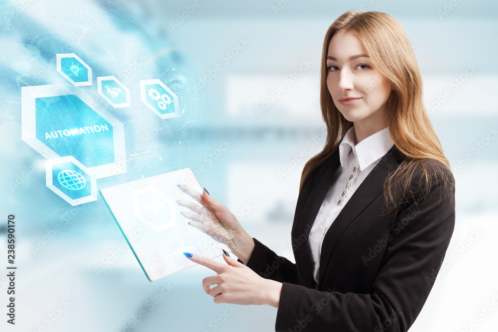 The concept of business, technology, the Internet and the network. A young entrepreneur working on a virtual screen of the future and sees the inscription: Automation The concept of business, technology, the Internet and the network. A young entrepreneur working on a virtual screen of the future and sees the inscription: Automation