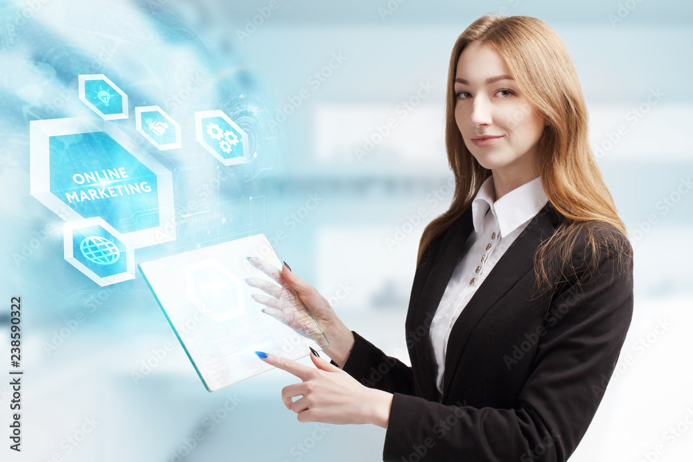 The concept of business, technology, the Internet and the network. A young entrepreneur working on a virtual screen of the future and sees the inscription: Online marketing The concept of business, technology, the Internet and the network. A young entrepreneur working on a virtual screen of the future and sees the inscription: Online marketing