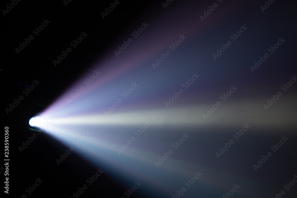 wide lens light beam for movie and cinema at night . smoke texture spotlight . black background for multimedia .