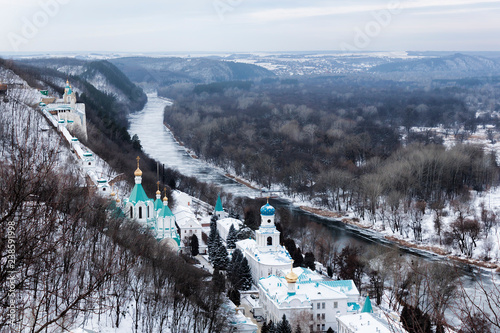 Sviatohirsk Lavra on the shore of the Seversky Donets in the winter. Top view photo