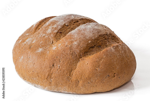 loaf of gray, round buckwheat bread on a white background. Round buckwheat bread view from the side on a white background