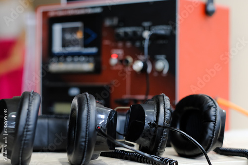 Close up of headphone and background is stereo cassette tape analog vintage.