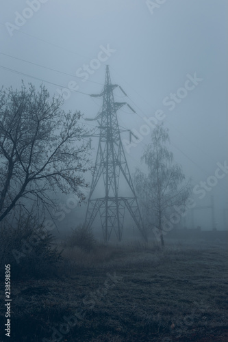 High-voltage pole in the mist