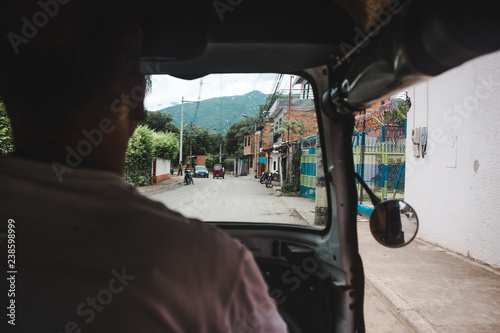 View from inside tuktuk driving down a back road of Santa Fe de Antioquia, Colombia