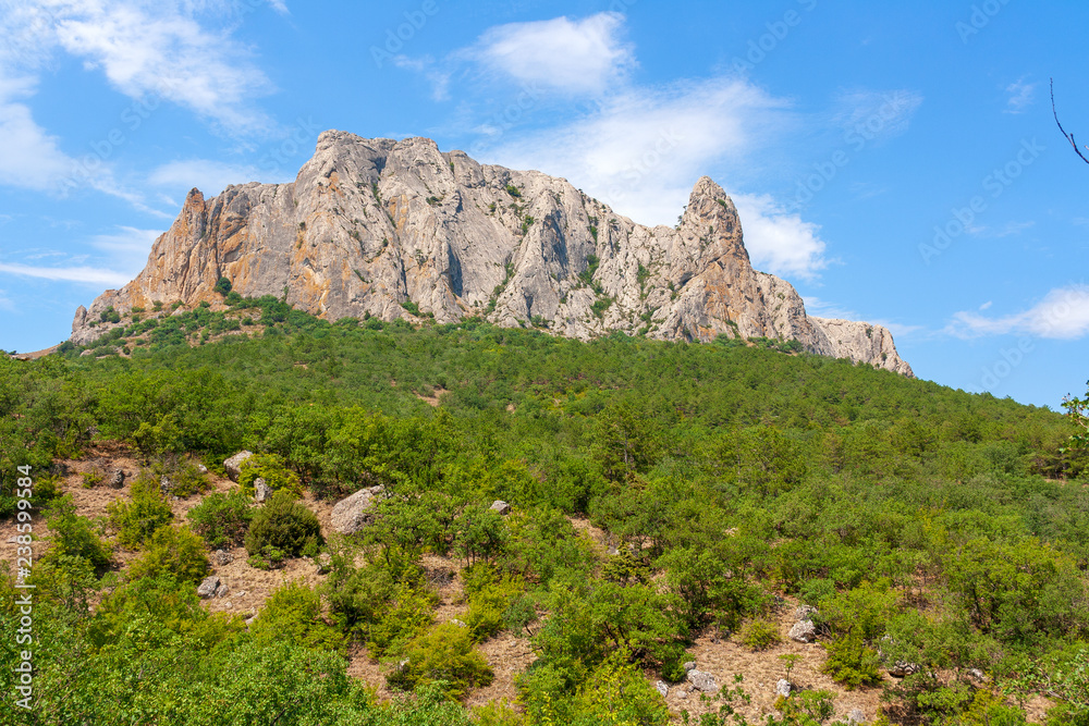 mountain landscape, a mountain with a Grand stone ridge on top