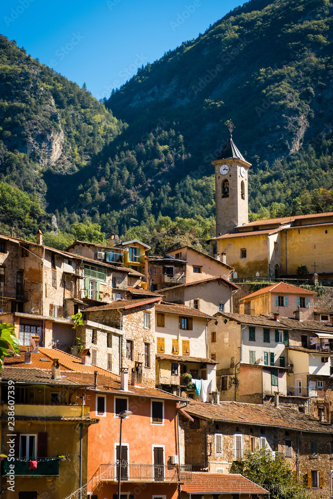 Hillside village with church in the southern Alps, Provence, France, warm colours