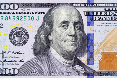 Benjamin Franklin on the 100 dollar bill macro photo. United States of America currency detail.