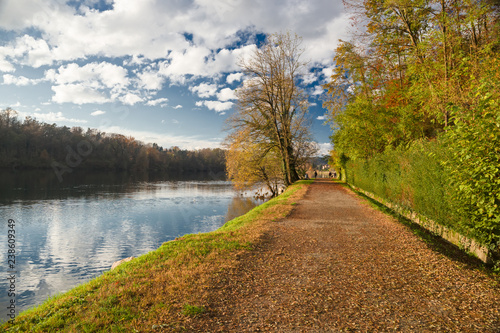 Quadro su tela Panoramic view of the promenade along the Ticino river in the sunset