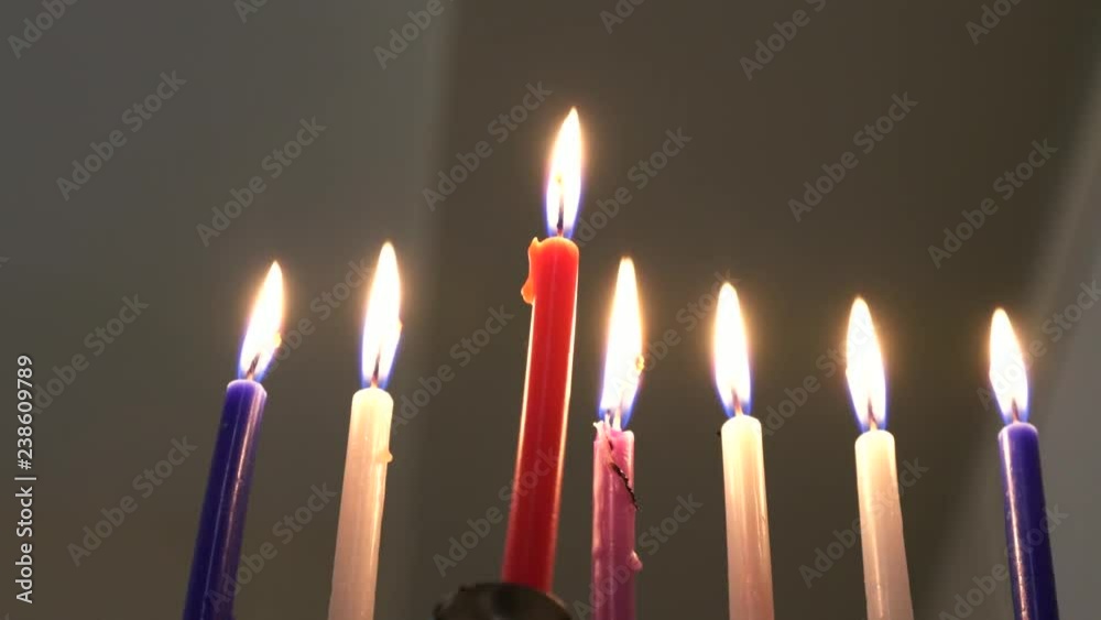 Seven candles in hanukkiah are burning on the sixth day of the Jewish holiday Hanukkah. Selective focus. 4k Seven candles in hanukkiah are burning on the sixth day of the Jewish holiday Hanukkah. Selective focus. 4k