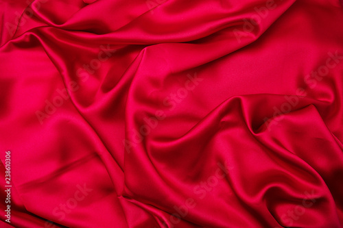 Passion red texture background. Abstract red drapery satin textile.