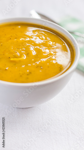 Close of white bowl with cabotia pumpkin soup