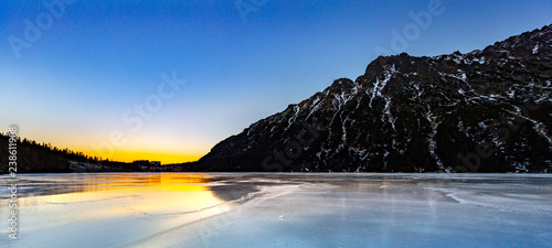 Eye of the Sea lake in Tatra mountains at sunset in a winter evening, Poland