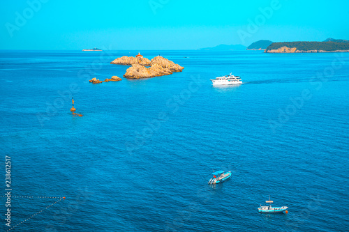 Aerial seascape view to turquoise waters of Adriatic Sea and islands the distance, near town Dubrovnik in Croatia. Famous sailing travel destination in Croatia, Dubrovnik summer scenery in Europe. photo