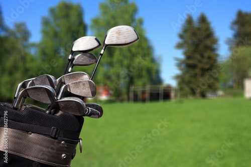 Golf clubs drivers over  background.