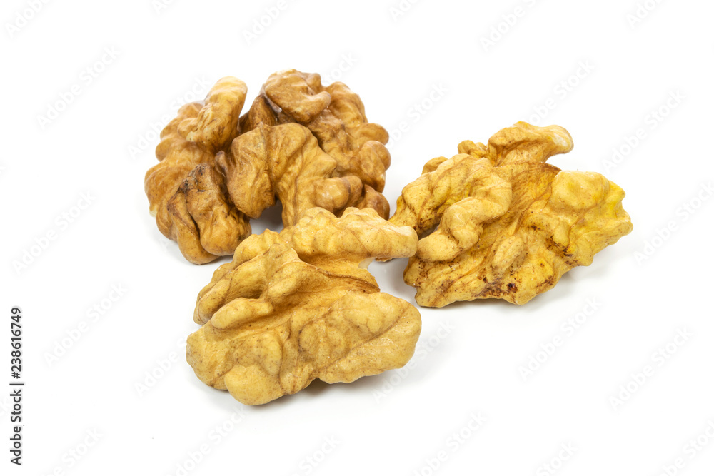 Dry and shelled walnuts isolated on a white background Dry and shelled walnuts isolated on a white background