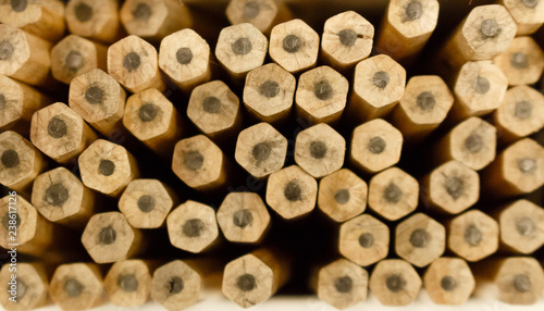 Back ends of lot of brown pencils. Clous up view. Shallow depth of field.