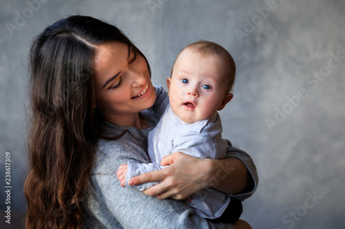 Beautiful young mother with her little son