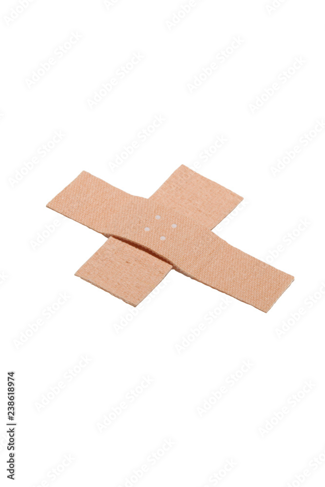 Zwei Pflaster über Kreuz geklebt Zwei Pflaster über Kreuz geklebt