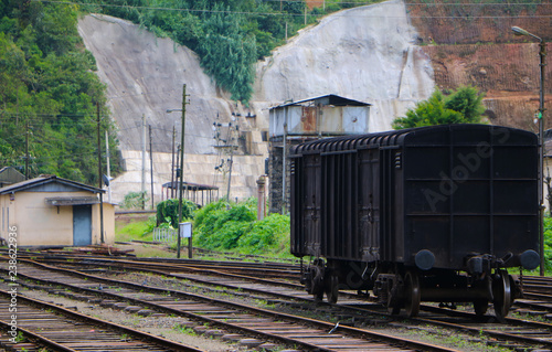 a single coach on the train station , black carriage on the abandoned railroad in Sri Lanka