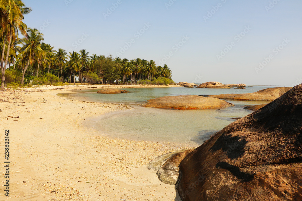 Tropical holiday in Sri Lanka, paradise lonely beaches with clear blue waters of the Indian ocean, calm resort, travel concept 