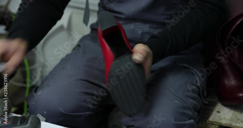 Shoe maker, master, craftsman, workman is manufacture, produce, make shoes in a small atelier. 