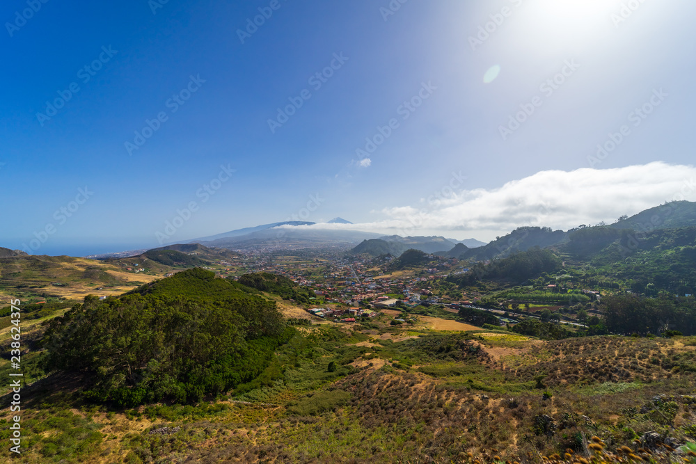 View of the valley, the old capital of the island of San Cristobal de La Laguna and the volcano Teide. Tenerife. Canary Islands. Spain. View from the observation deck - Mirador De Jardina.
