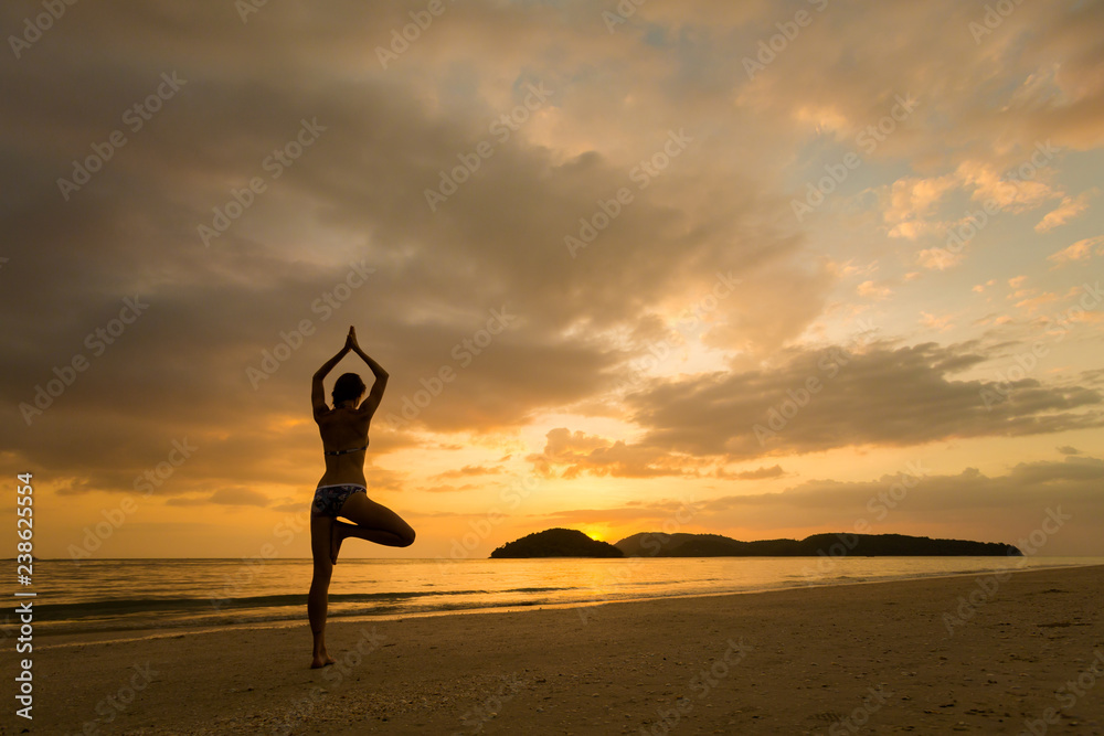 Girl practicing yoga Langkawi island