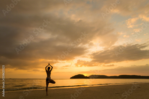 Girl practicing yoga Langkawi island photo