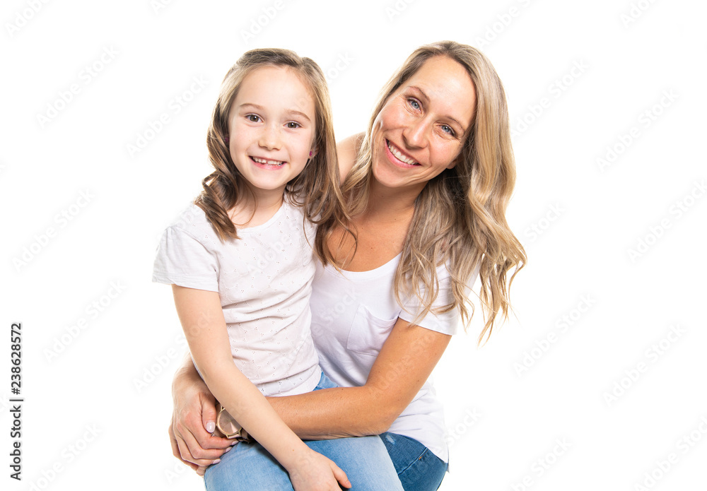 A mother and daughter portrait isolated on white studio. A mother and daughter portrait isolated on white studio.