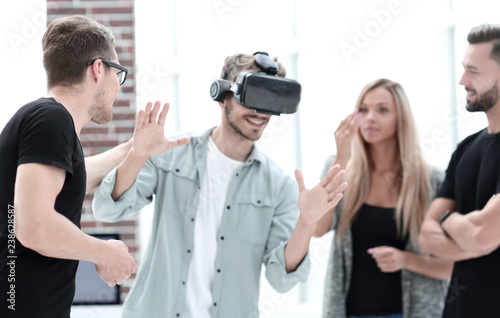 Positive colleagues testing virtual reality glasses