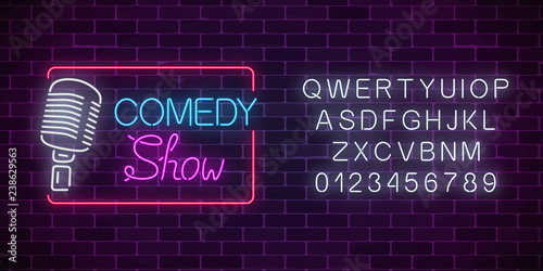 Neon comedy show sign with retro microphone and alphabet. Humor monolog glowing signboard.