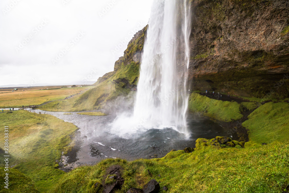 Obraz premium Beautiful Seljalandsfoss waterfall falling in pool, scenic, Iceland