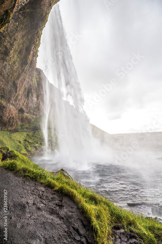 View from behind of scenic Seljalandsfoss, ring road, Iceland