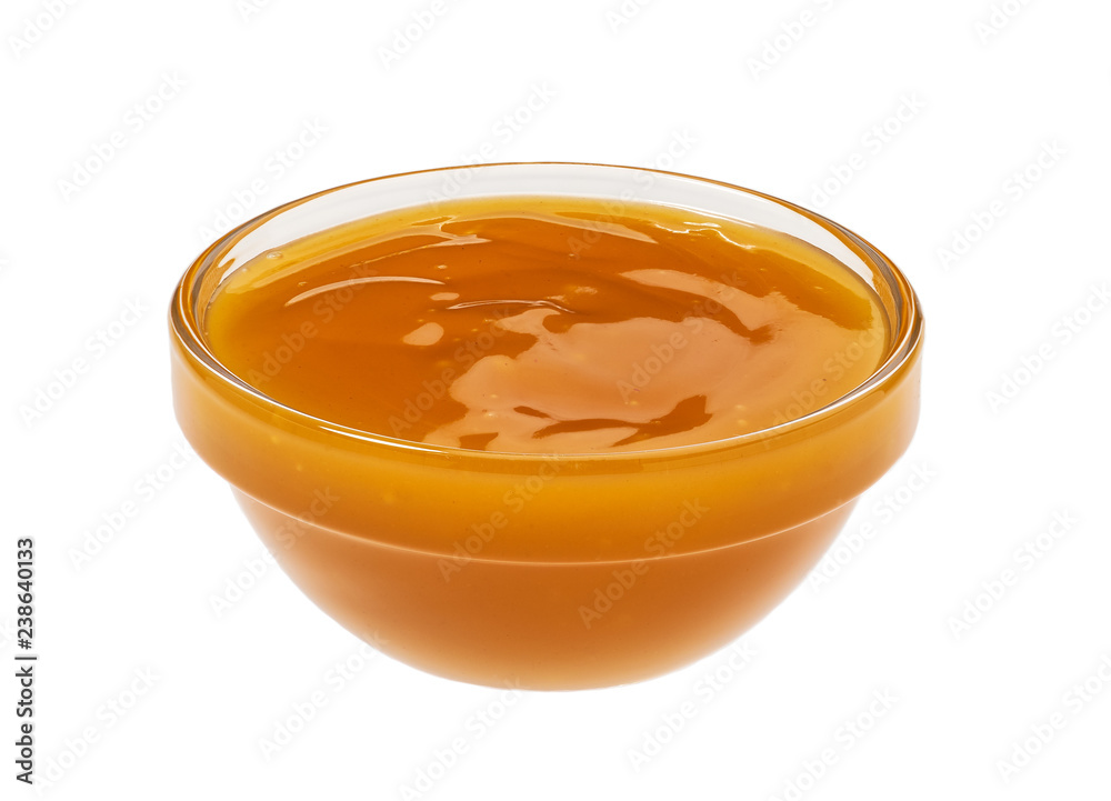 Orange sweet and sour sauce in bowl isolated on white background. Chicken sauce Orange sweet and sour sauce in bowl isolated on white background. Chicken sauce