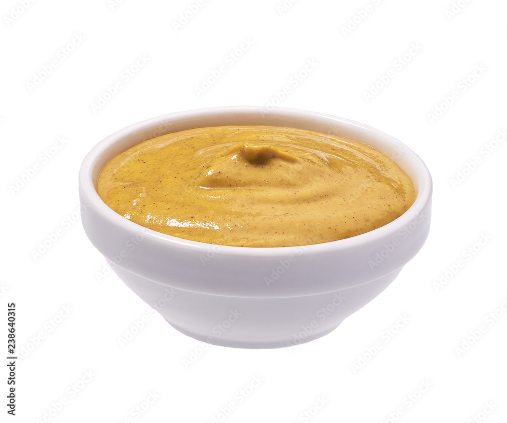 Mustard sauce in ceramic bowl isolated on white