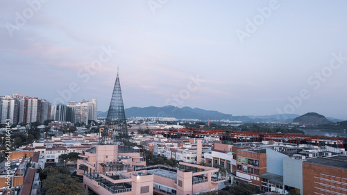 view of city city at dusk with tops and sea in the background