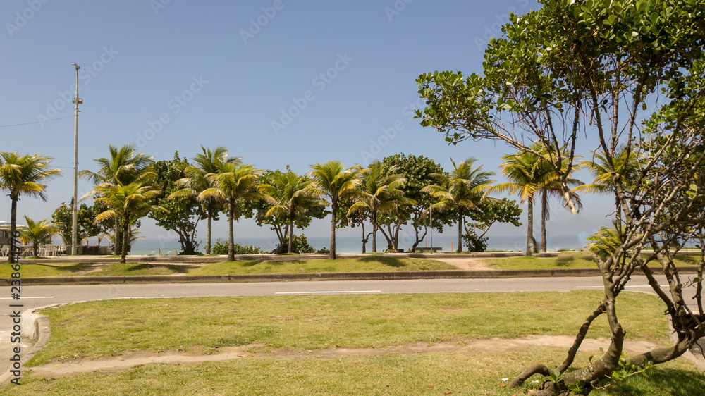 View of beachfront with kiosk and chairs View of beachfront with kiosk and chairs